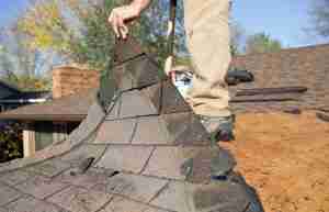 worker repairing a roof